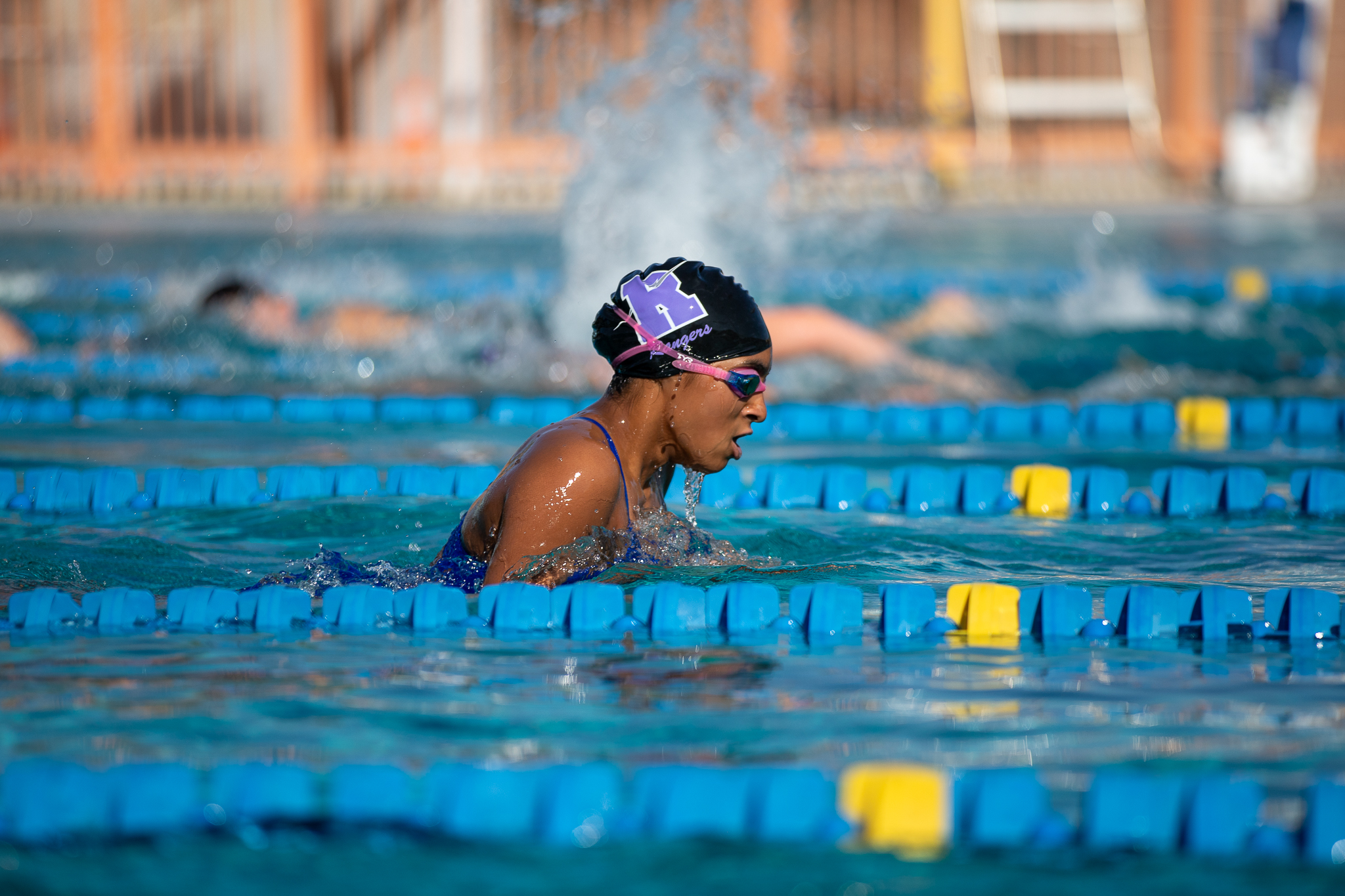 An RUHS swimmer swims across the pool