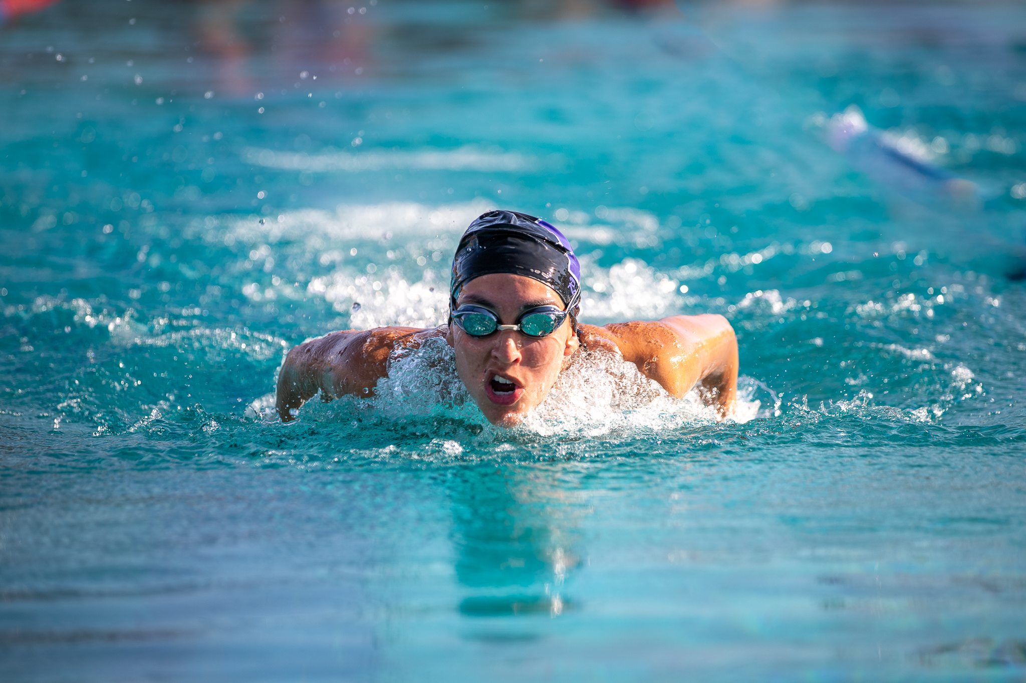 An RUHS swimmer comes up for air